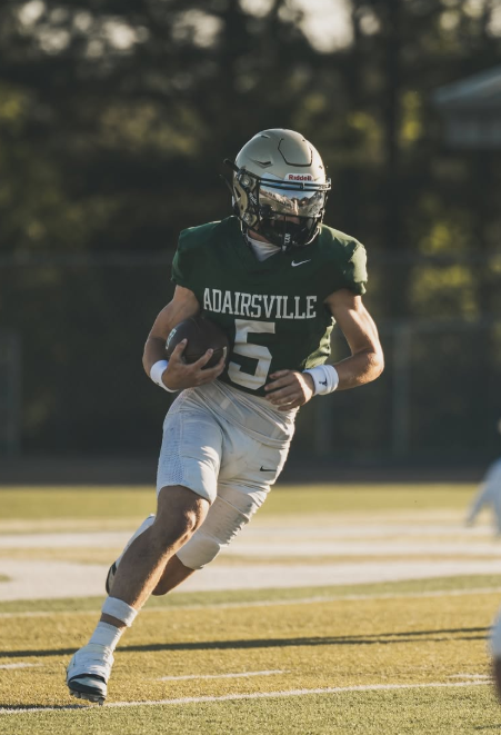 Adairsville #5 carrying the ball upfield