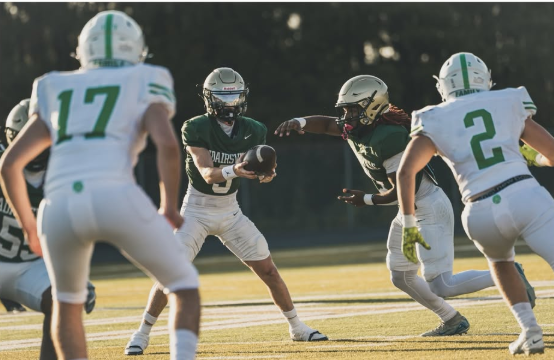 Adairsville Tigers running back taking a handoff